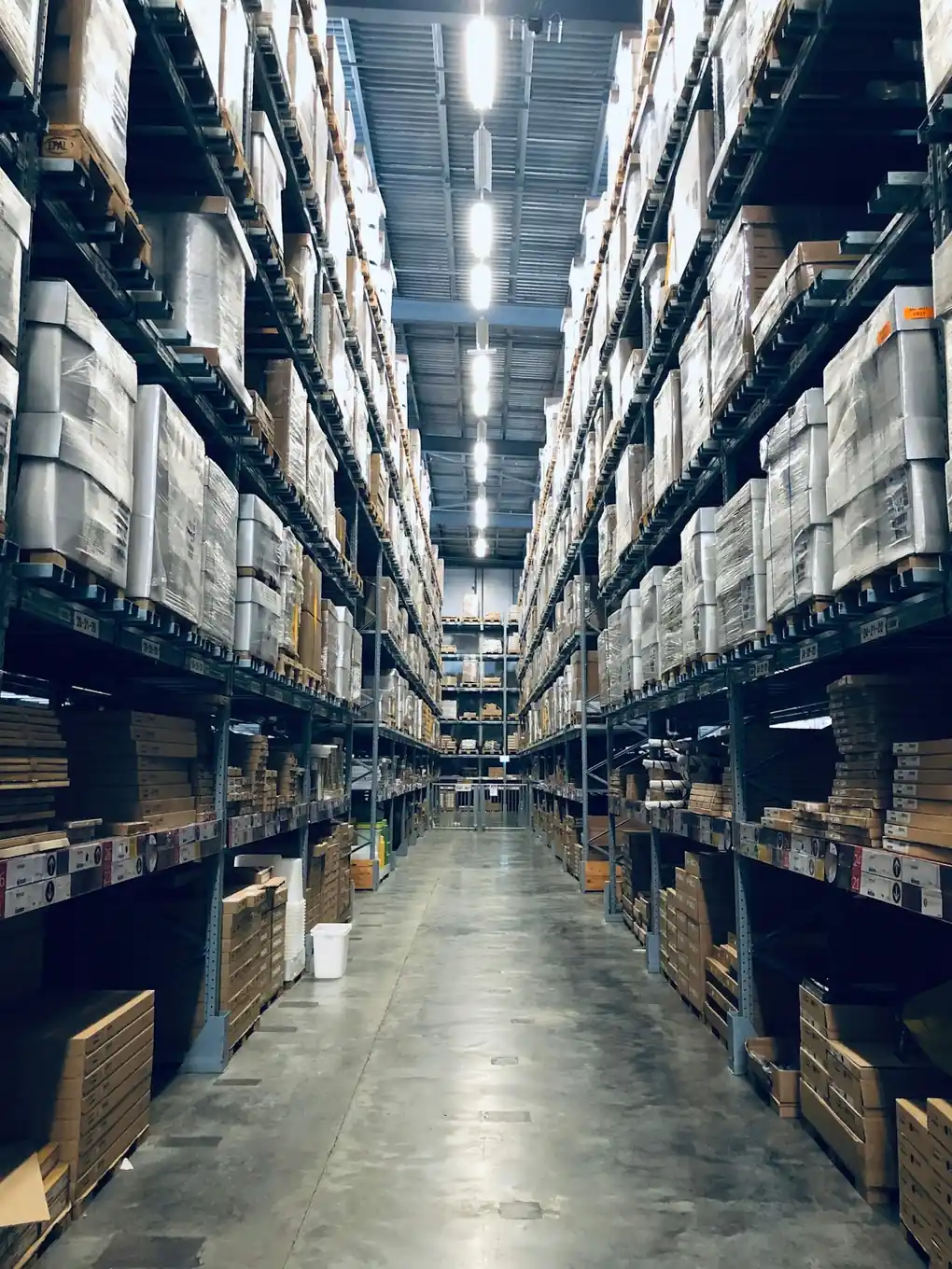 Warehouse aisle with parcels ready for dispatch after label cropping