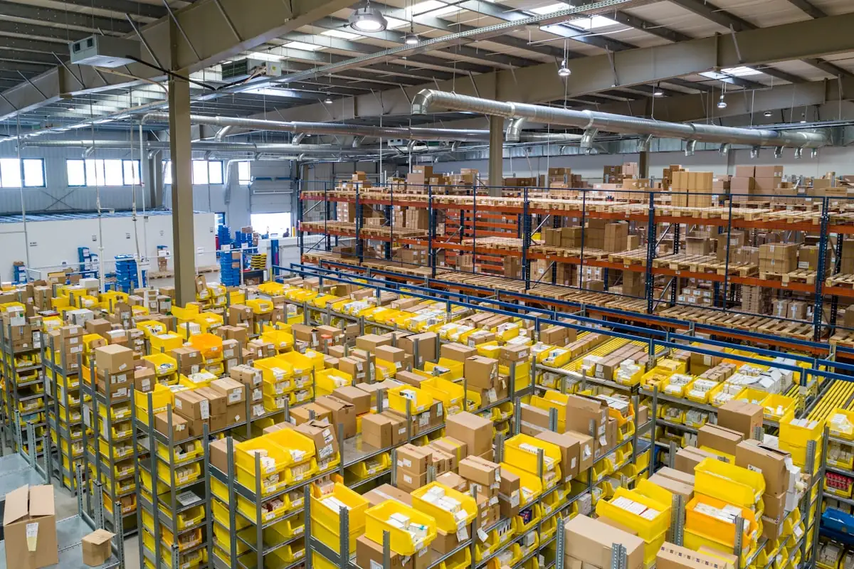 Warehouse floor stacked with parcels in yellow strapping